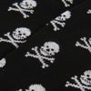 Black fabric with white skull and crossbones pattern
