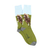 A pair of patterned cotton socks featuring a horse racing scene with green, brown, white, and gray colors.