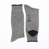 Gray marl socks with black accents on a white background