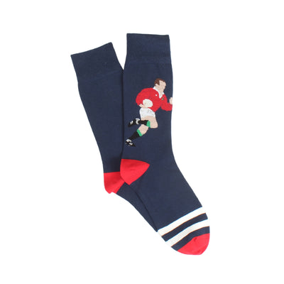 Navy sock with a graphic of a rugby player in a red shirt and white shorts, on a white background.