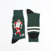 Green sock with a soccer player design photographed on a white background
