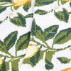 Close-up of a fabric with green leaf pattern on a white background