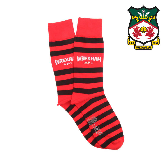 Red and black striped socks with 'Wrexham AFC' text, next to the club's logo on a white background.