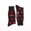 Black socks with red dragon patterns on a white background