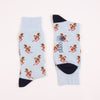 Two  pale blue socks with squirrel designs with a navy heel and toe 