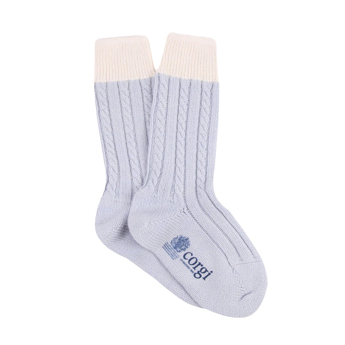 Light blue sock with white cuff on a white background

