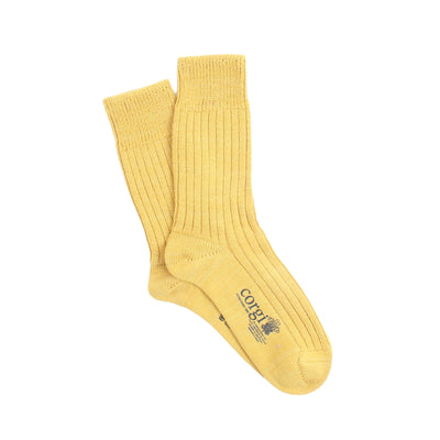 Pair of yellow socks with a brand logo on a white background
