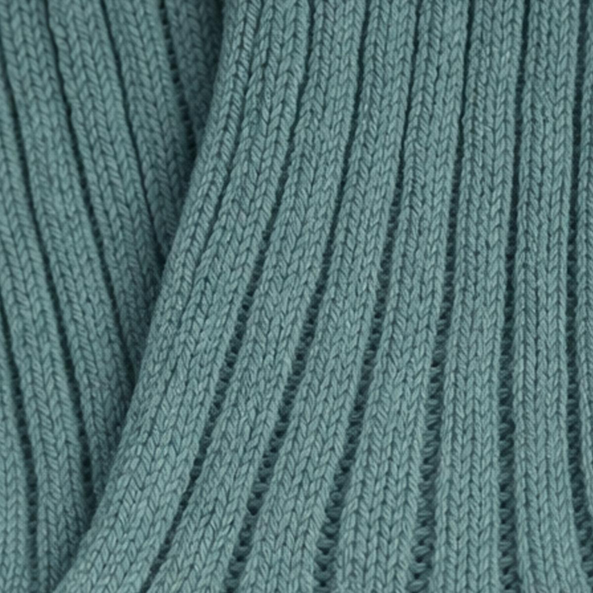Close-up of teal knitted fabric texture