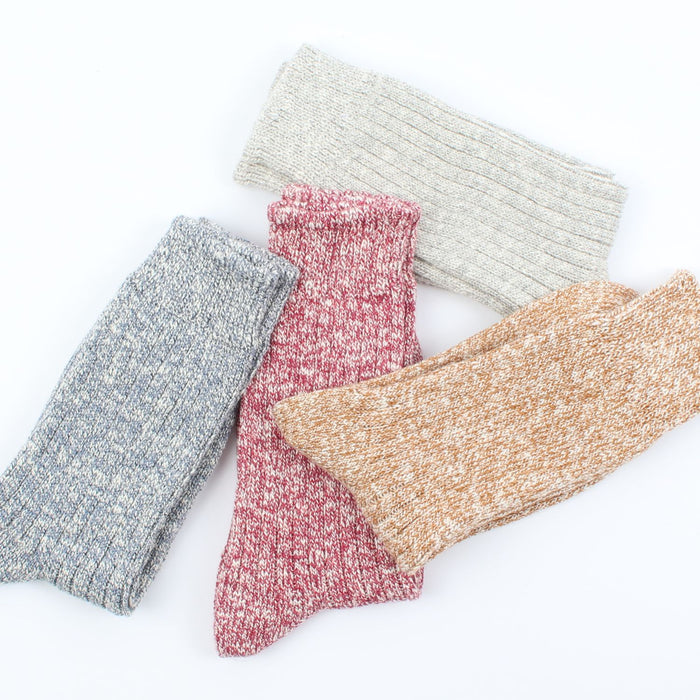 photo showing the four colourways available in this sock design.