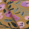 Close-up of a fabric with floral pattern on a yellow background