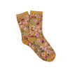 Mustard yellow socks with floral pattern on a white background