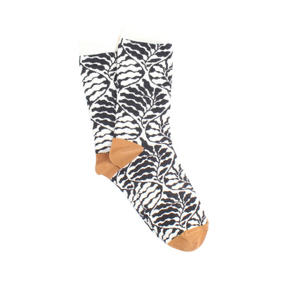 Modern floral print sock with brown toes and heels on a white background