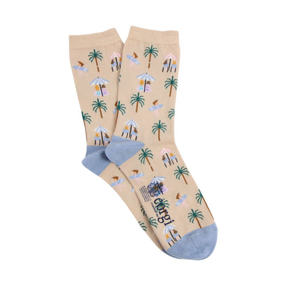 Beige socks with tropical pattern and blue heel and toe photographed  on a white background