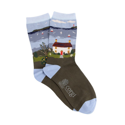 Socks with a scenic design of a house and lake, featuring the Corgi brand logo.