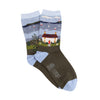 Socks with a scenic design of a house and lake, featuring the Corgi brand logo.