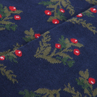 Navy fabric with green leaf and red berry pattern