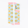 A pair of kids' knee-high socks with a floral pattern in pink and aqua green colours.