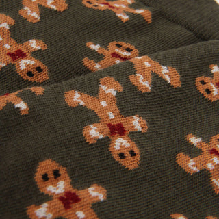 Gingerbread man pattern on a dark background