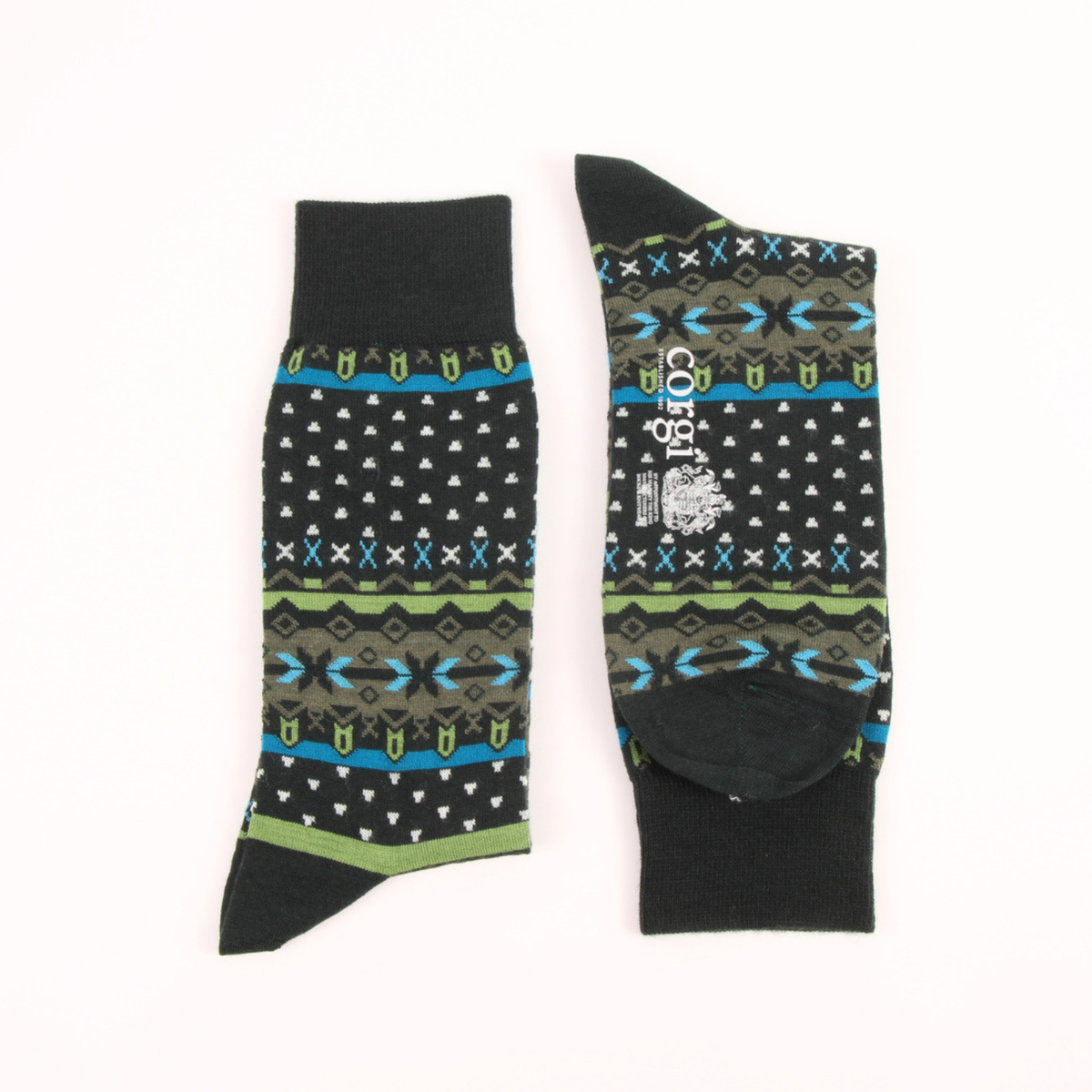 A pair of black crew socks with a colorful geometric pattern featuring blue, green, and white accents, displayed flat against a white background.
