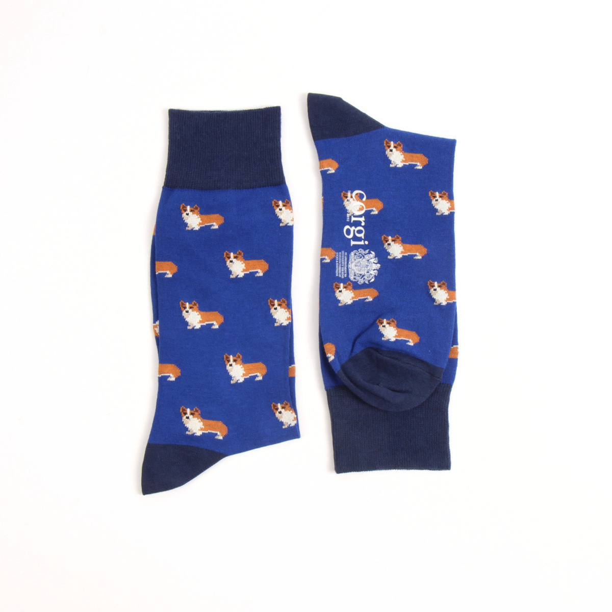 A pair of blue crew socks with a repeating pattern of corgi dogs and navy blue ribbed cuffs, heels, and toes, displayed on a clean white background.