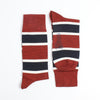 Red, white, and blue striped socks on a white background