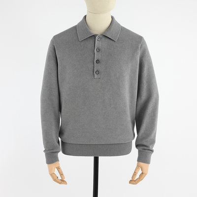 Gray sweater with button collar on a mannequin against a white background