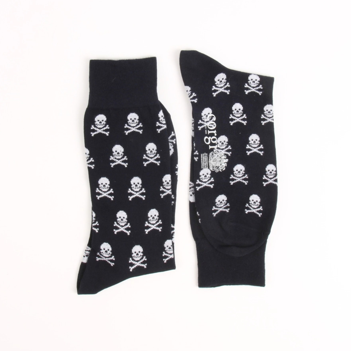 A pair of navy crew socks with a repeating white skull and crossbones pattern, displayed flat against a plain white background.