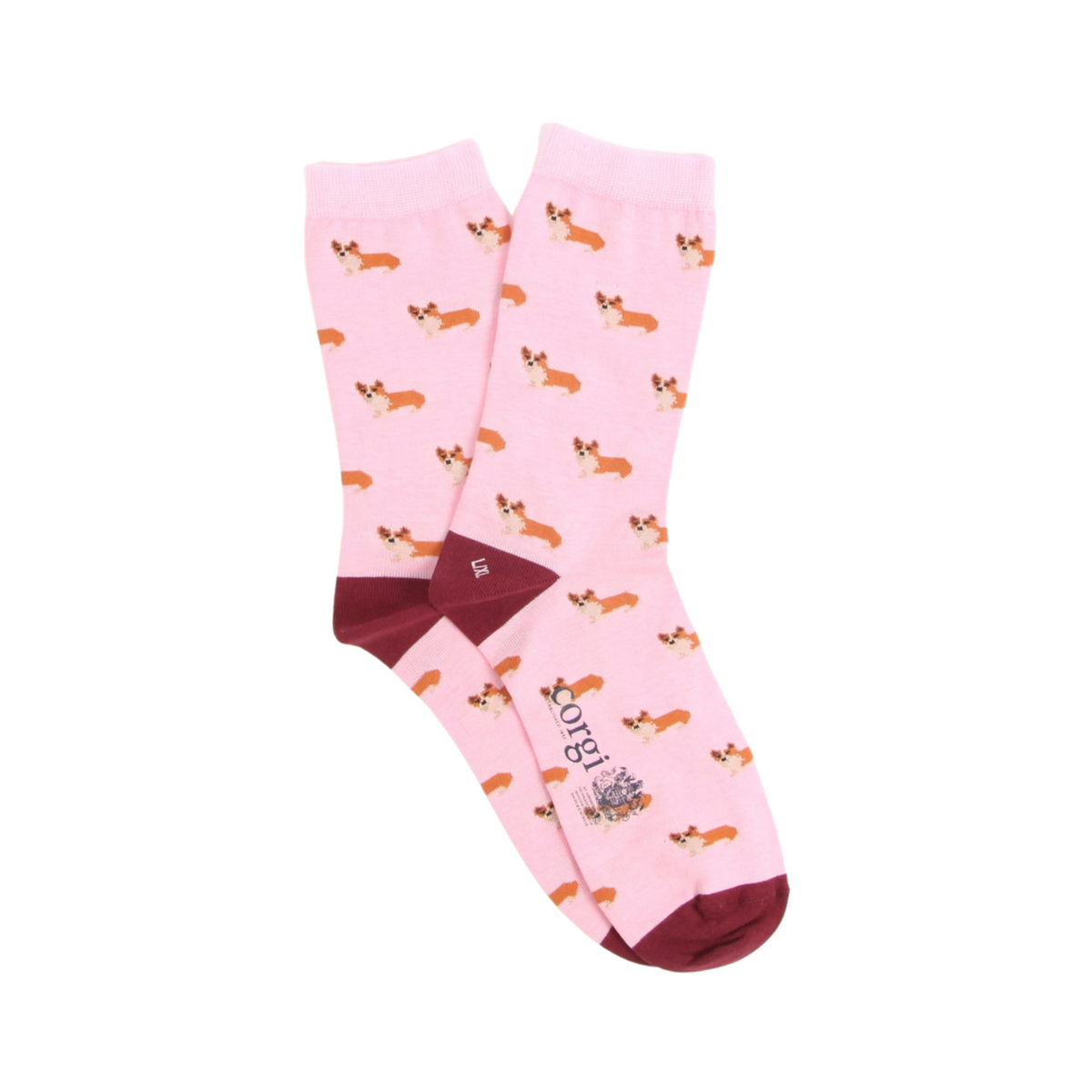A pair of light pink crew socks featuring an all-over print of Pembroke Welsh Corgi dogs, with dark burgundy heels, toes, and cuffs. The brand name 'Corgi' is printed vertically on the side of one sock.