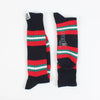 Pair of socks with red, green, and navy stripes on a white background