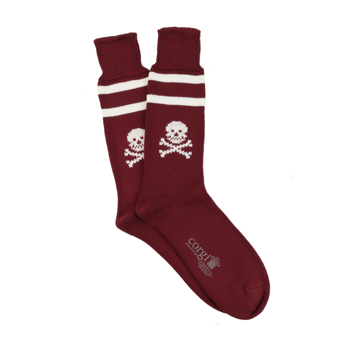 Maroon socks with skull and crossbones design on a white background