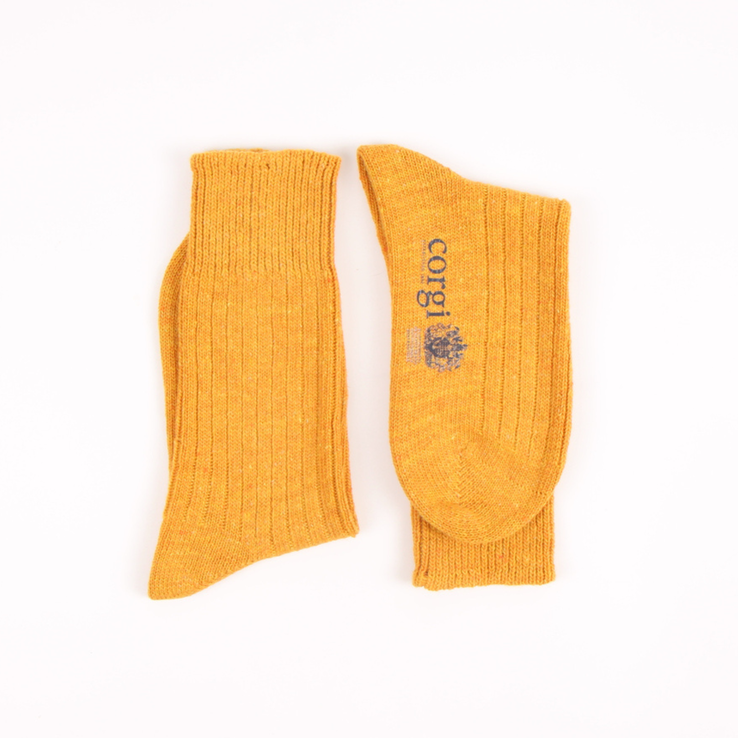 Pair of mustard yellow socks with 'corgi' branding on a white background