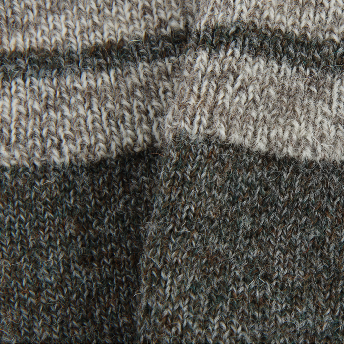 A pair of men's striped cuff British wool socks in gray with a subtle neon flash on the toe, designed for comfort and sustainability close up.