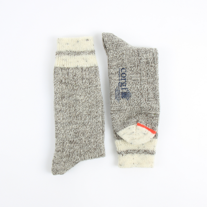 British Wool socks laid flat side by side on a white background.