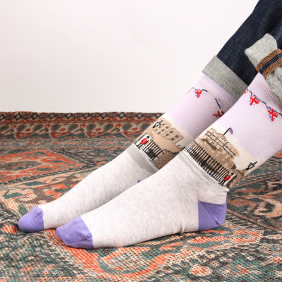 Pair of socks with a unique pattern on a textured surface