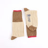 Pair of brown and beige leg socks with a visible brand logo on a white background