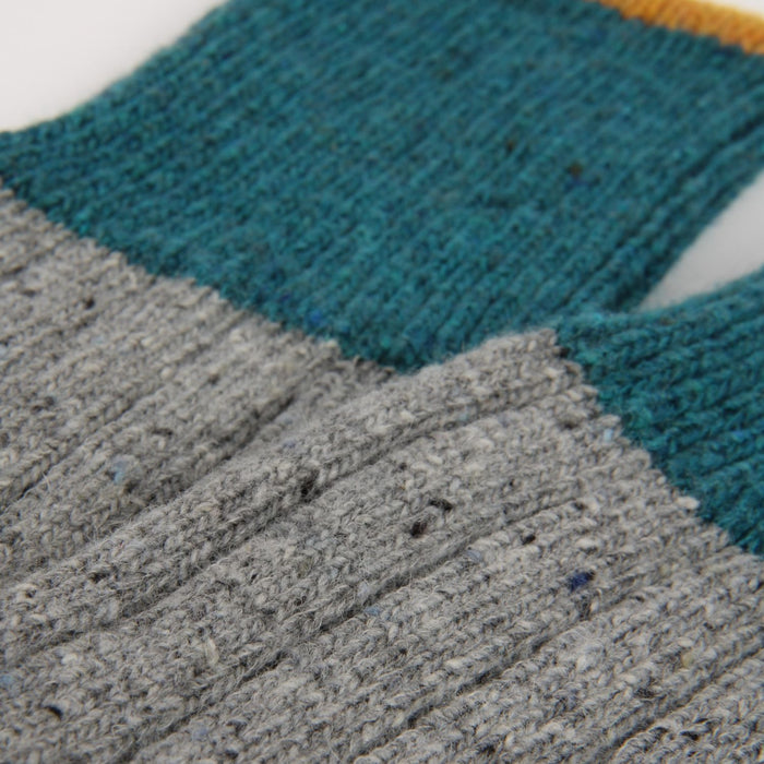 Close-up of a sock with grey and teal accent