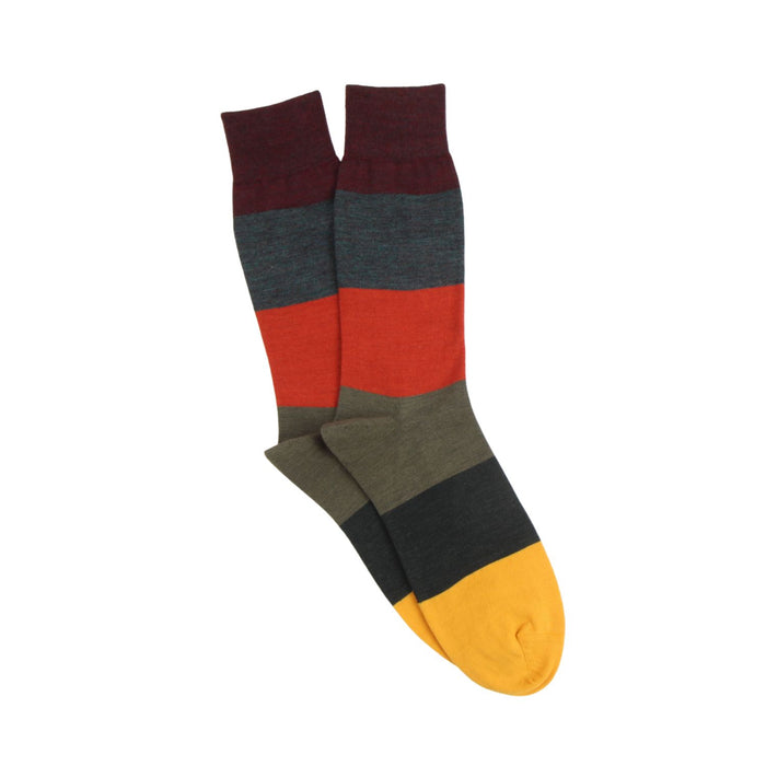Colorful striped sock with a yellow toe on a white background