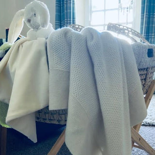 A beautiful white 100% cashmere honeycomb stitch baby blanket would make a perfect gift for a new born baby, by Corgi Socks.