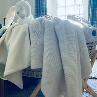 A beautiful white 100% cashmere honeycomb stitch baby blanket would make a perfect gift for a new born baby, by Corgi Socks.
