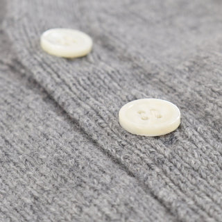 A sumptuous, grey button-down hooded cardigan for baby available in both wool and cashmere is a special treat that every new parent and baby will love, by Corgi Socks.