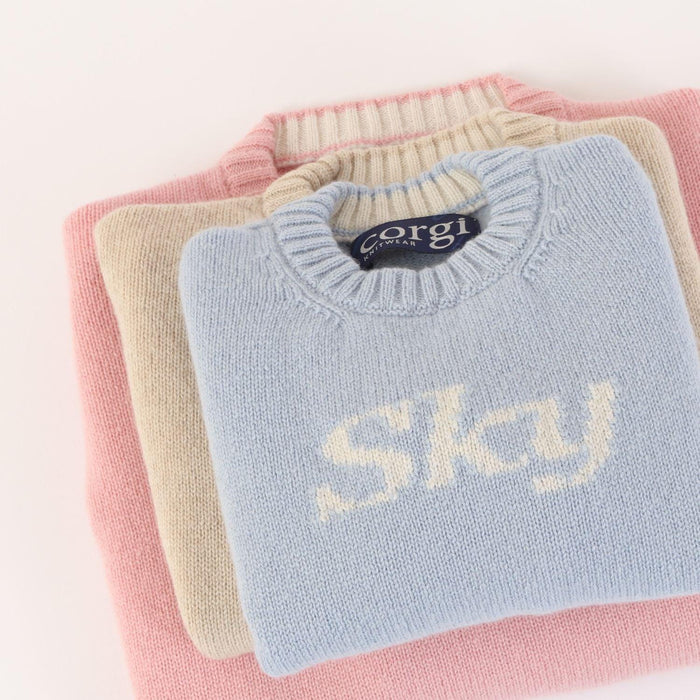 A sumptuous, long sleeved baby sweatshirt, personalised to your babies name available in pink, brown and blue. Choose from both wool and cashmere, by Corgi Socks.