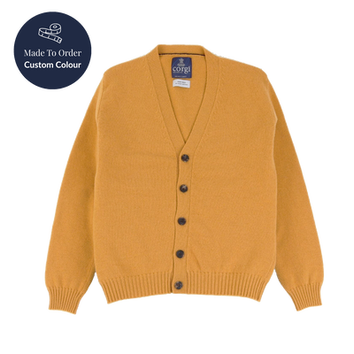 Mustard yellow cardigan with black buttons on a white background, featuring a 'Made to Order Custom Colour' label.