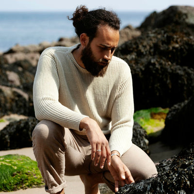 man wearing white linen sweater