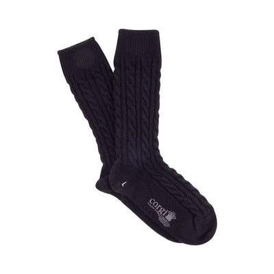 A pair of blue cashmere socks with a cable knit pattern, displayed against a white background.