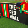 Collection of scarves on the football stand with The Red Wall logo.
