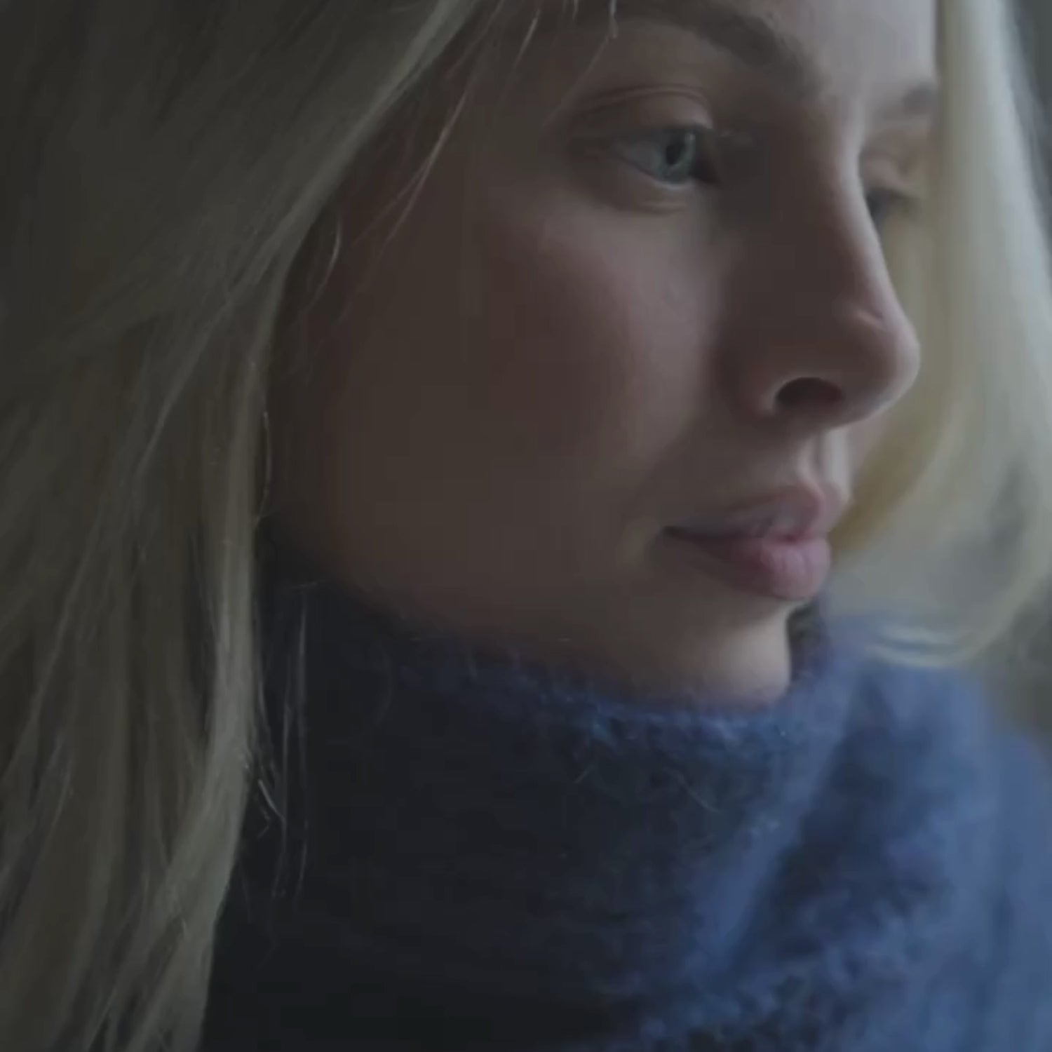 video of person wearing mohair scarf in blue