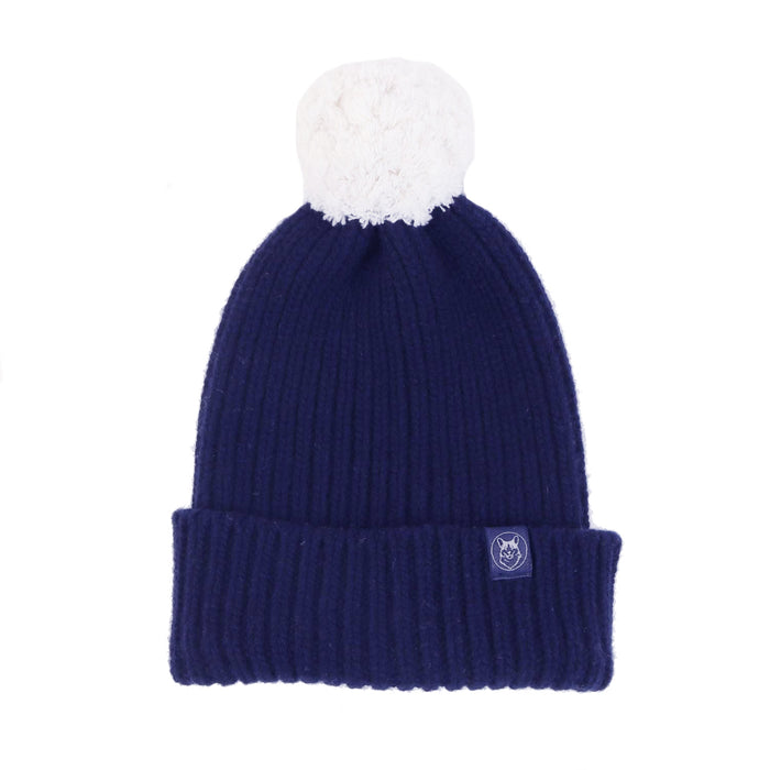 navy hat with white pom pom 