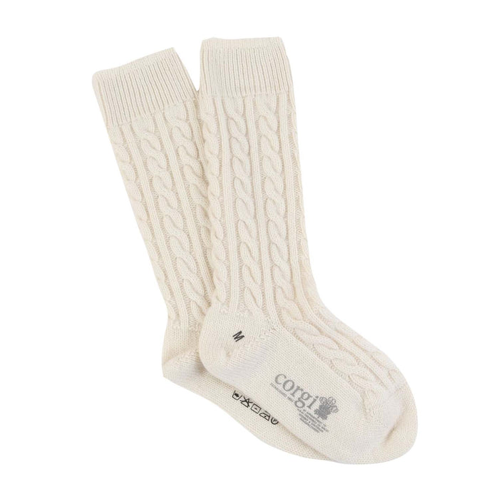 A pair of white cashmere socks with a cable knit pattern, displayed against a white background.